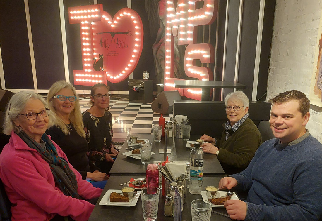 group of people eating at Hell's Kitchen during a Minneapolis food tour